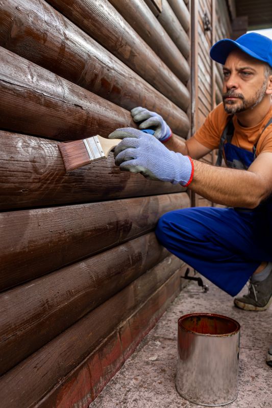 Local Log Home Staining pros at work